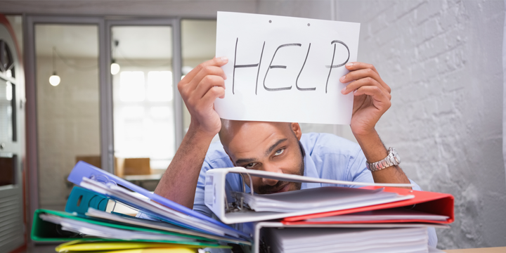 guy holding a help sign 