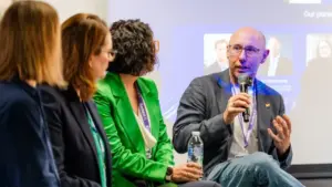 a panel of speakers on stage at kortext live 2025