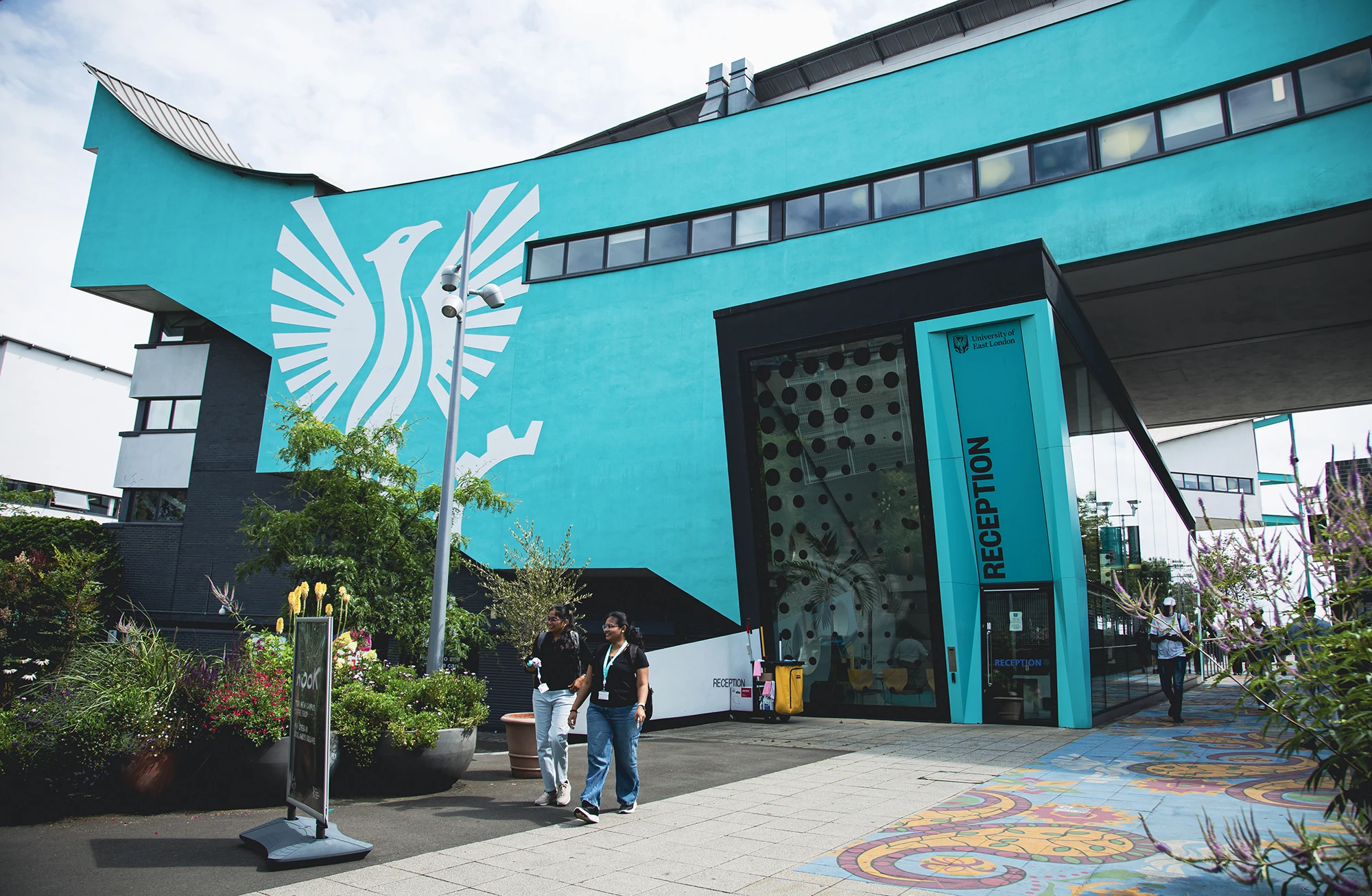 UEL reception building exterior with distinctive teal bird mural