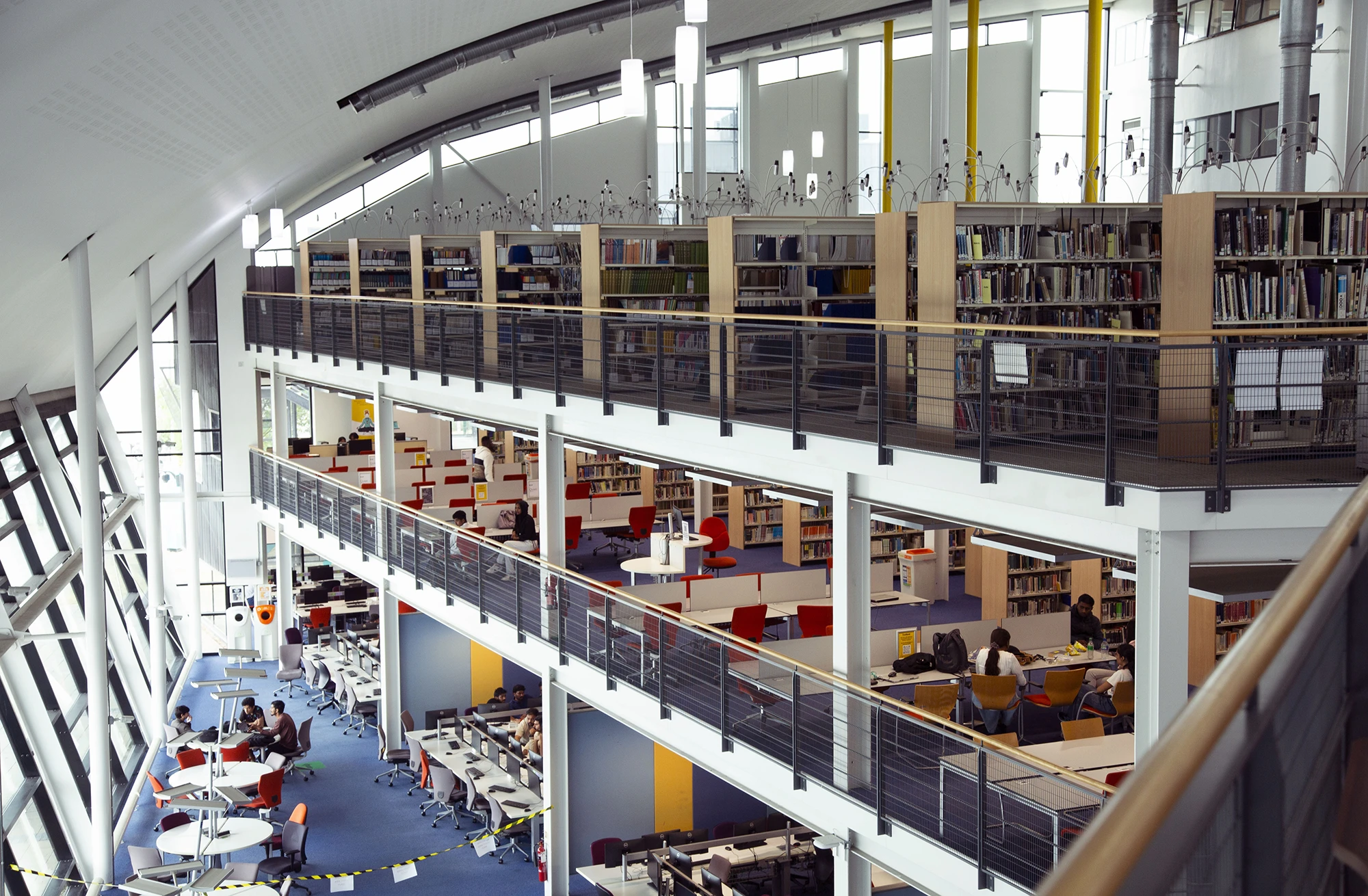 UEL library interior with bookshelves, computers and study areas