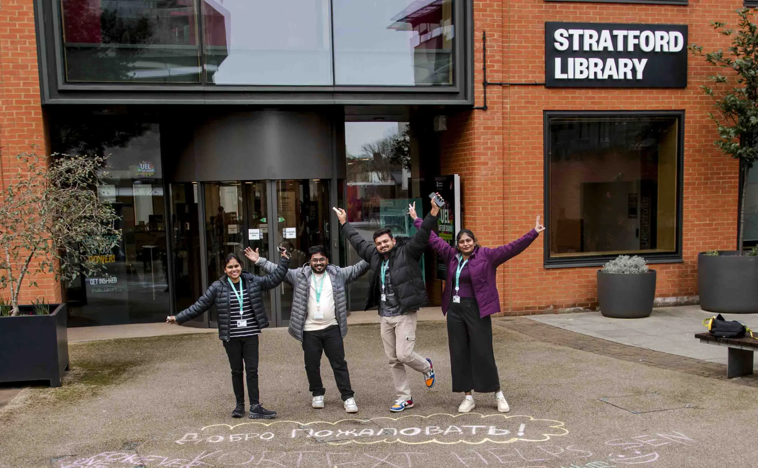 Four students outside Stratford Library at UEL