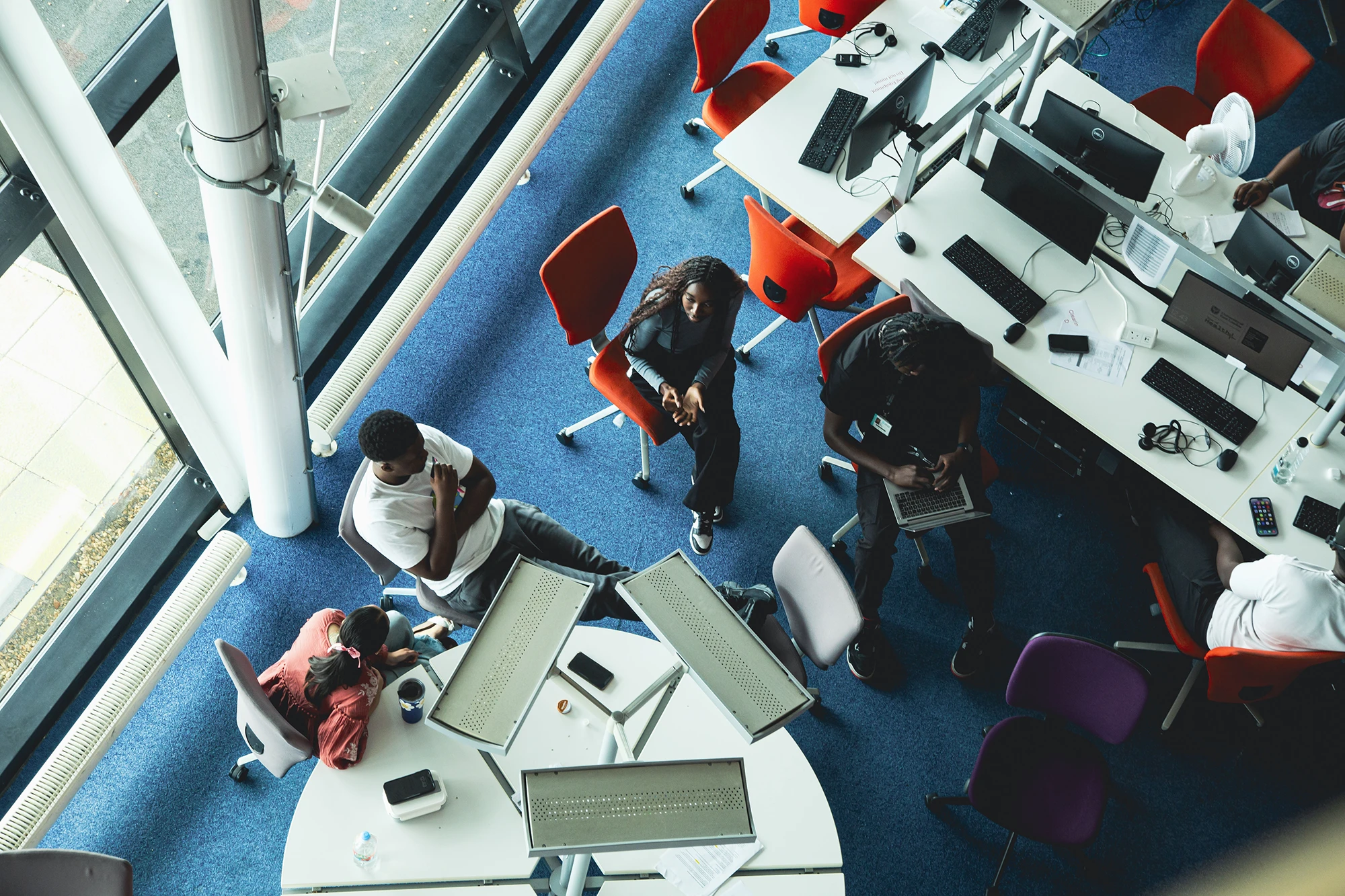 Aerial view of students collaborating in a UEL library space