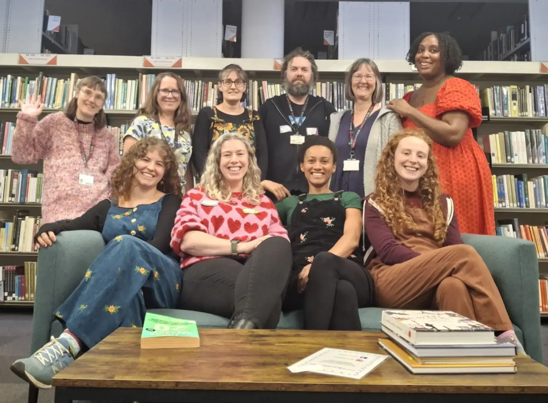 This photo shows the team together posing for a photo inside the RNCM library