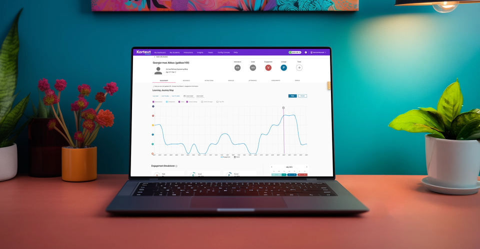 A laptop on a desk shows a student learning journey map on Kortext stream