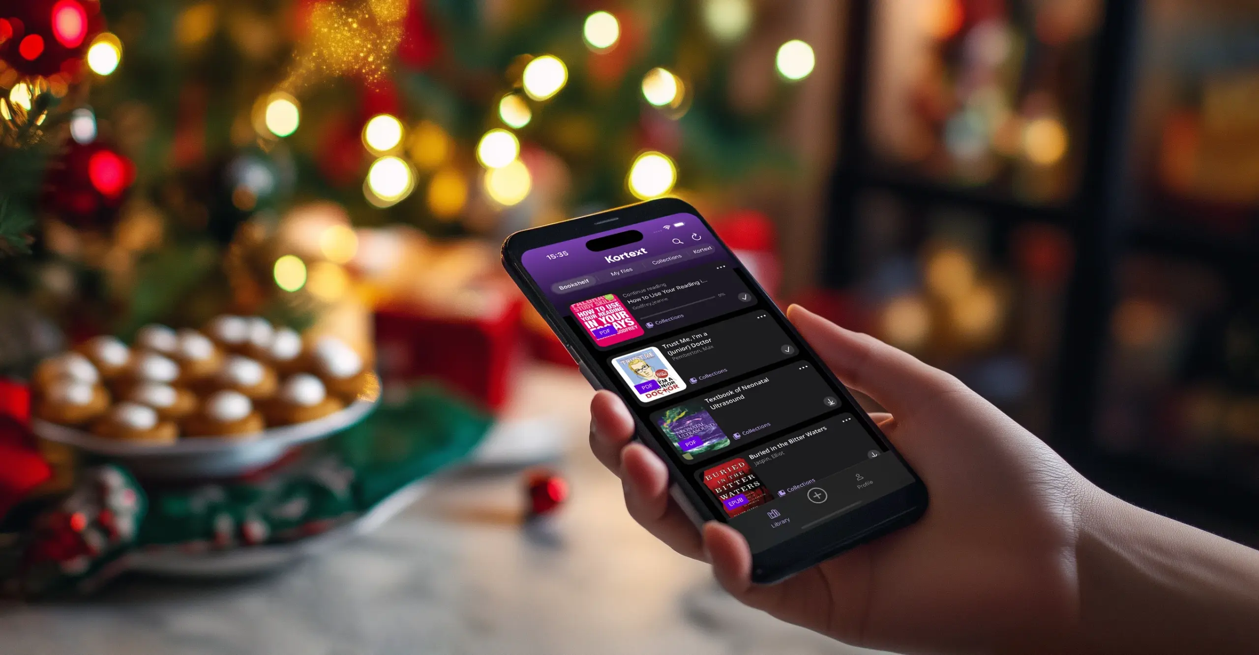This person is using the Kortext mobile app on their phone while they celebrate with their family at Christmas time